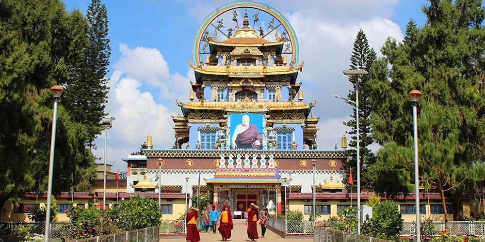 Golden Temple Bylakuppe Namdroling Monastery with giant golden Buddha statues
